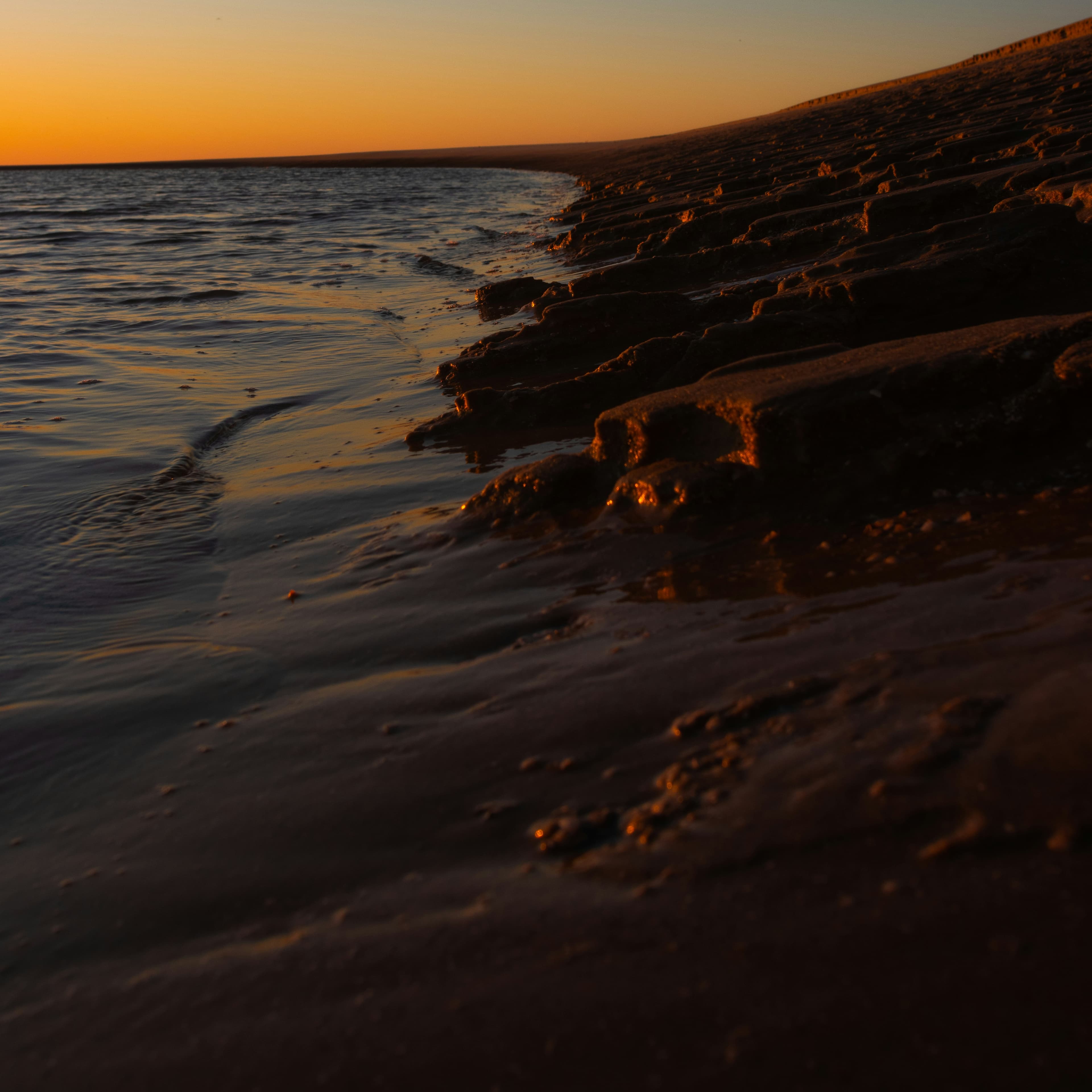 Sunset over the water at a beach on St. Simons Island, Georgia