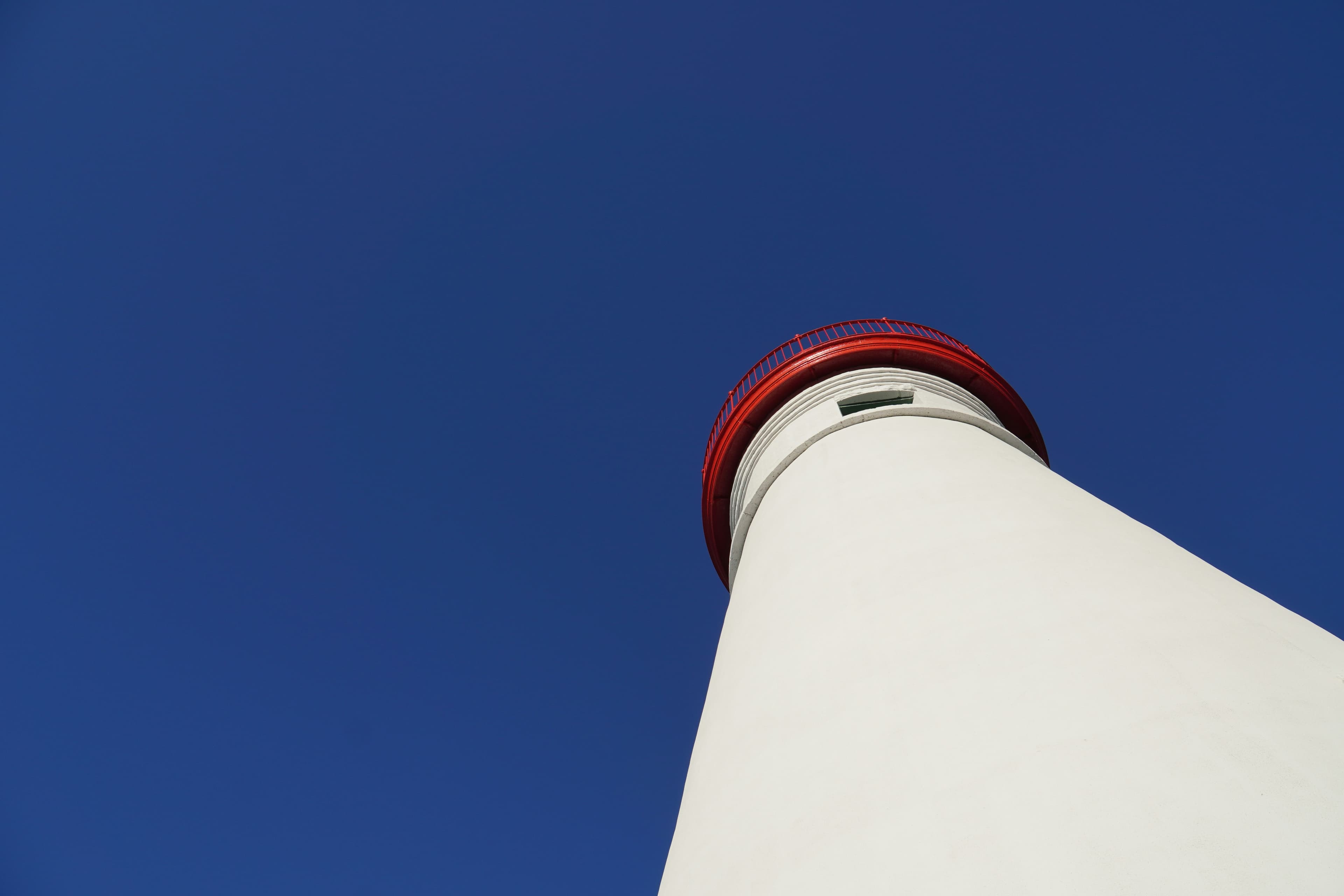 Marblehead Lighthouse, white with a red lantern, on the Lake Erie shore in Ohio